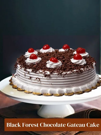 My take on the classic Black Forest Chocolate Gateau. This cake features layers of chocolate sponge, fresh cream, and cherries, topped with chocolate shavings for a timeless and beloved dessert experience.