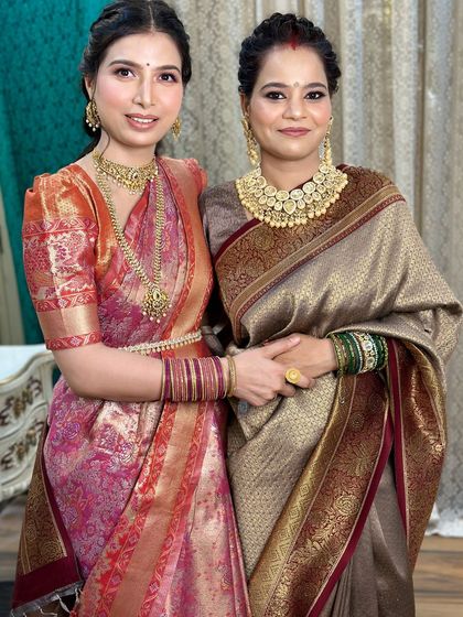 Another beautiful portrait of the sisters. Their makeup is coordinated but tailored to their individual features.
