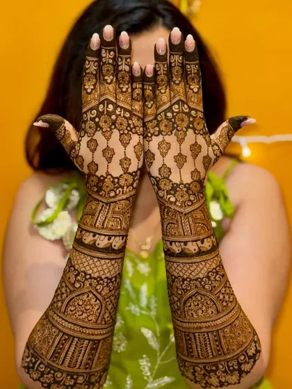 A full view of the symmetrical back-of-hand design. The intricate patterns and clean lines create a stunning visual effect.