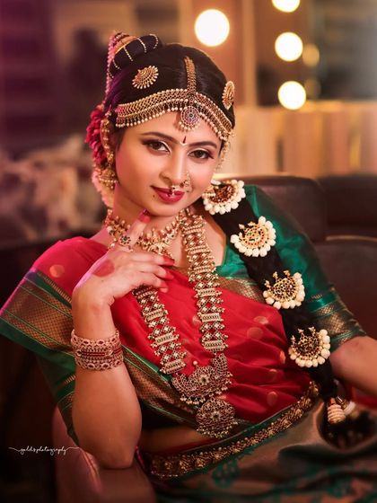 A beautiful Iyengar bride look, complete with traditional temple jewelry and flower garlands. These shots are perfect for a bridal portfolio, showcasing the complete look from makeup to attire.
