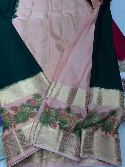 The bottle green and peach semi-Mysore crepe saree, perfect for festive occasions.