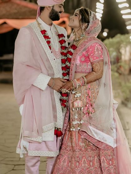 A beautiful portrait of the couple after their wedding rituals, looking at each other with love and happiness.