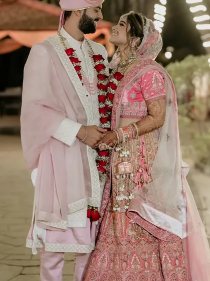 A beautiful portrait of the couple after their wedding rituals, looking at each other with love and happiness.