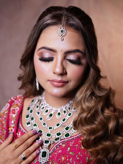 A close-up of the soft waves, showing how they beautifully frame the face. This is a classic and elegant choice for any bride who wants to wear her hair down for one of her events.