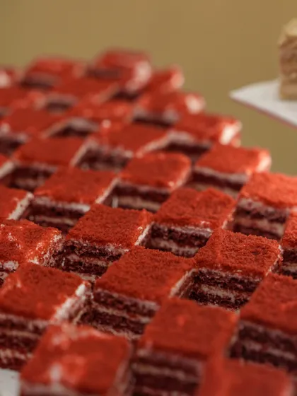 A close-up of our vibrant red velvet pastries, a popular and visually striking addition to any dessert table.