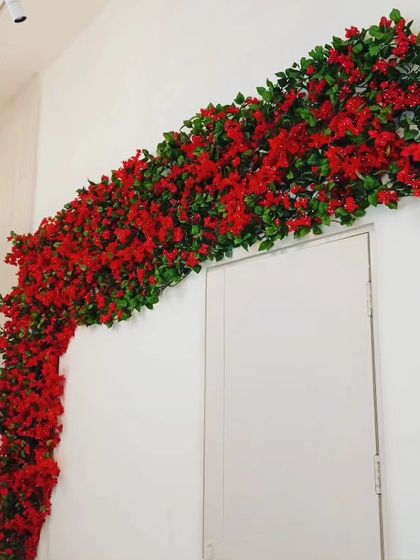 Another view of the red bougainvillea installation over a doorway. It provides a permanent burst of color that won't fade or drop petals.