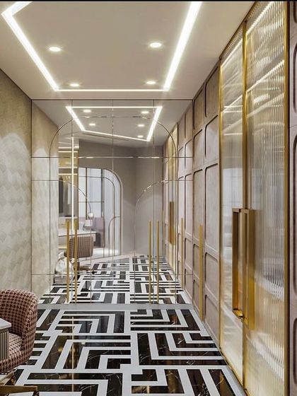 A full view of the luxurious walk-in closet with geometric flooring. The design includes a vanity area and a mix of wardrobe styles to suit different storage needs.