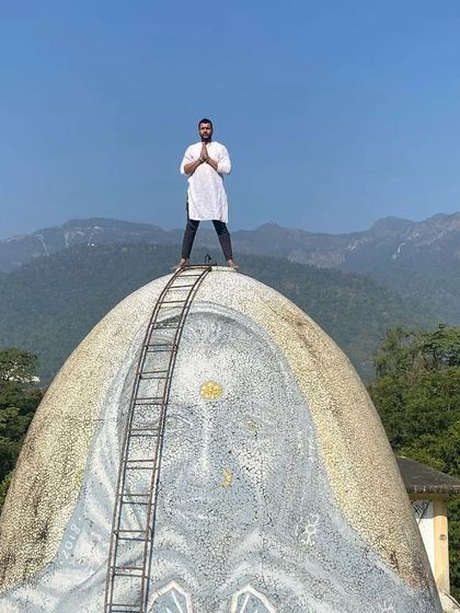 On top of the world, or at least on top of one of the domes at the Beatles Ashram. A moment of peace and gratitude.