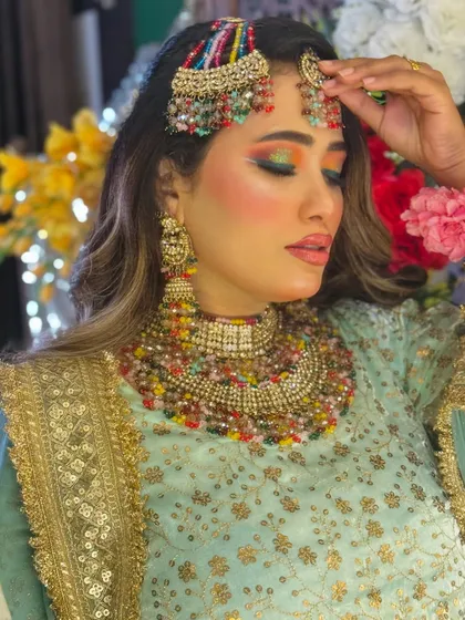 Another look at the Haldi bride's makeup, with a focus on the colorful eyeshadow and the perfectly defined brows.