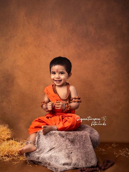 A cheerful smile from our little Rama, capturing the joy and innocence of childhood within a grand, mythological theme.