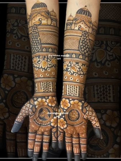 A beautiful blend of floral and traditional motifs, this design features palace architecture and peacocks on the arms. The palms are adorned with flowers and personal symbols, creating a balanced and customized bridal look.