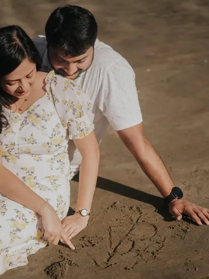 A playful memory in the making. We love capturing these spontaneous activities, like drawing your initials in the sand, which make your pre-wedding moments uniquely yours.