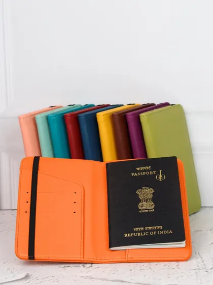 Our travel passport organizer, shown open to reveal slots for your passport, cards, and other documents. Available in many vibrant colors.
