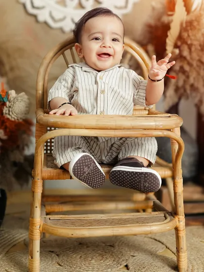 A close up portrait capturing the infectious giggle of a baby during his sitter session. My focus is always on capturing these genuine expressions of happiness that you will cherish forever.