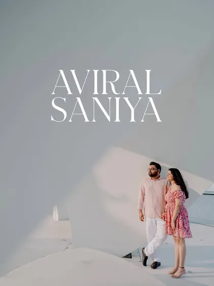 A minimalist and modern pre-wedding portrait taken against a clean, white architectural background in Dubai. This style is perfect for couples who love contemporary design.