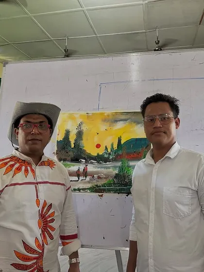 Posing with a completed landscape painting during the second day of my workshop at Gogamukh College in Dhemaji.