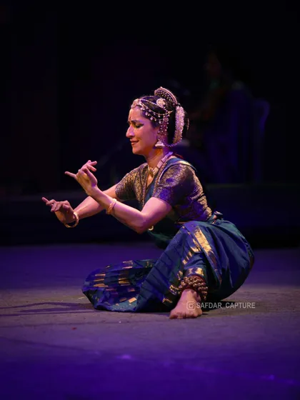 A seated pose from the performance, showing how stories can be told from different levels and perspectives on stage.