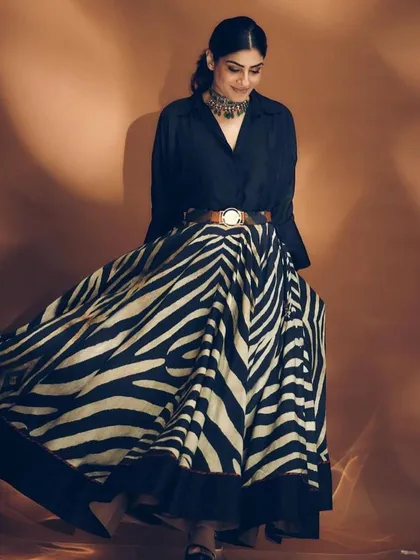 The movement of the skirt is incredible, and the controlled, sleekness of the low ponytail provides a perfect balance. This is how we create a cohesive story in an editorial shoot.