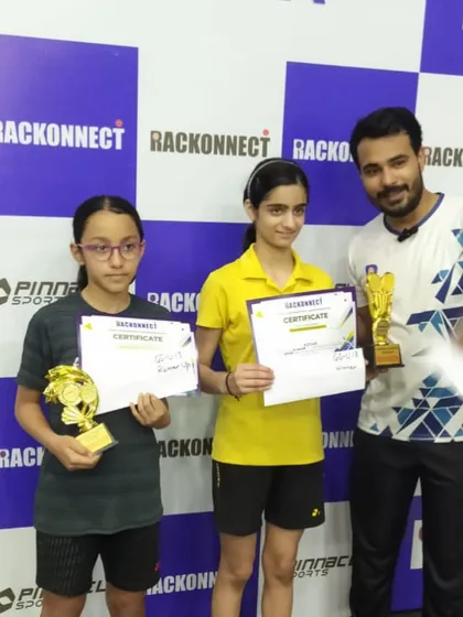 We build champions, both boys and girls. Here are two of our dedicated female players after their win at a competitive tournament, holding their trophies and certificates. Hard work knows no gender.