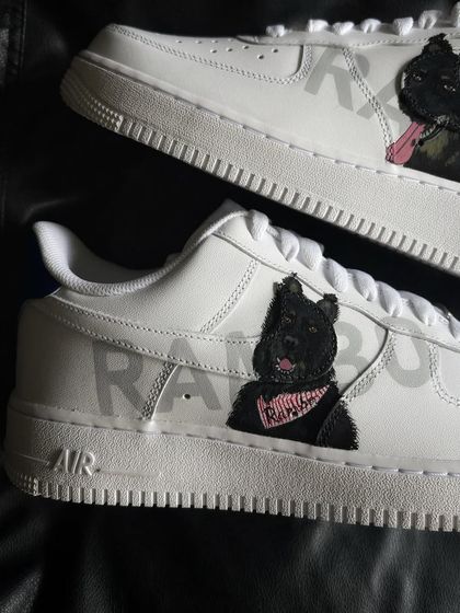 A detailed close-up of the Rambo portrait, showing him wearing a pink bandana.