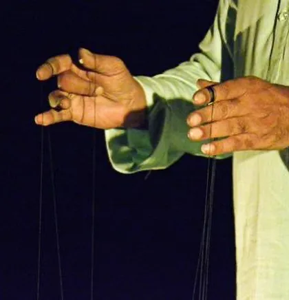 It all begins with the hands. For generations, my family has learned to tell stories through these strings. This is the art of manipulation, where every small movement gives life to the puppet.