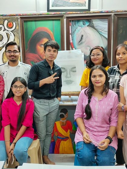 A group photo of our proud students and their instructor after a successful pencil shading workshop, with their amazing artworks on display.