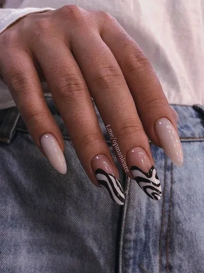 A cool, abstract take on animal print with these black and white zebra-inspired swirls on a neutral base.