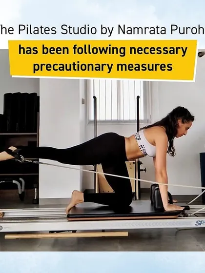 A client performs a single-leg kickback on the Reformer, an excellent exercise for targeting the glutes and hamstrings while stabilizing the core. This demonstrates the precision and control that are central to my Pilates method.