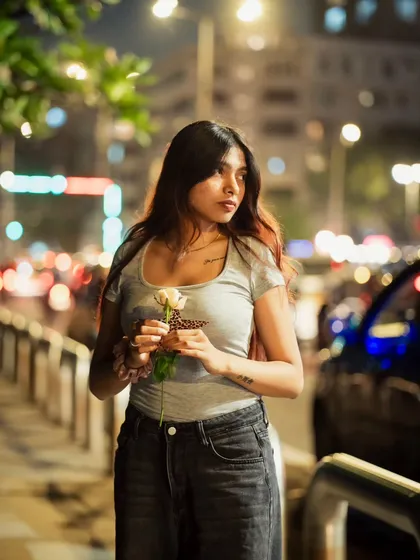 A moody night portrait captured on the streets of Mumbai. I use the city's ambient light to create a filmic vibe, focusing on emotion and atmosphere for influencer-style content.