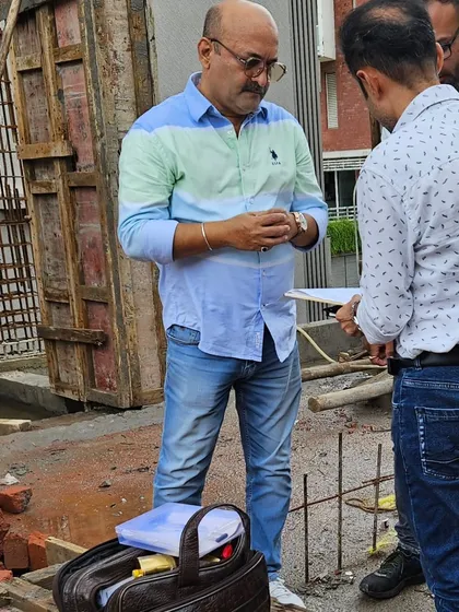In deep discussion with a client at his construction site. I believe in explaining the 'why' behind my recommendations so clients feel empowered.