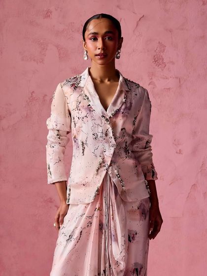 A chic draped skirt and blazer co-ord set in a subtle abstract print, blending sharp tailoring with soft draping.