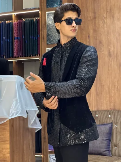 A client trying on a black sequined Indo-Western outfit in our store. The perfect lighting and mirrors help you see every detail of your new look.
