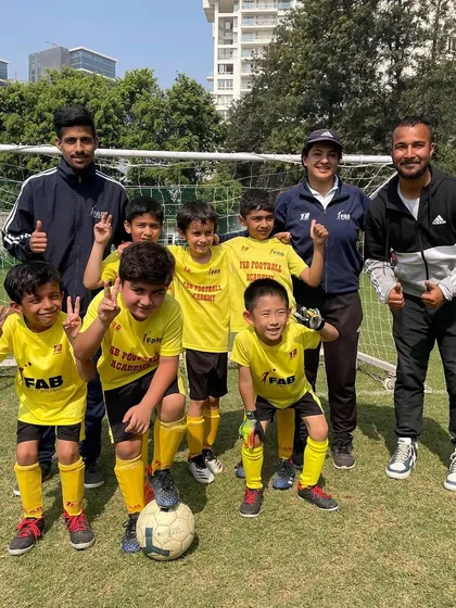 A team photo with coaches. Our personalized and age-appropriate programs are designed to unlock each player's full potential.