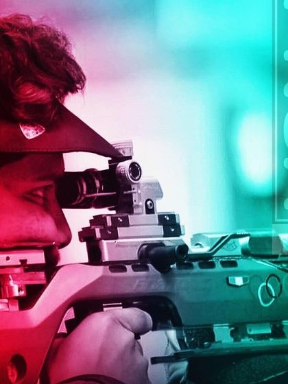 A close up of a shooter taking aim with a professional air rifle. We train our athletes on the same caliber of equipment they will use in national and international competitions.