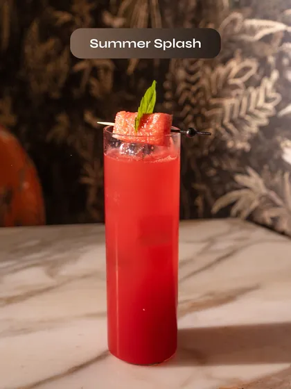 The Summer Splash, a vibrant and refreshing watermelon cocktail. It's the perfect drink to beat the heat, featured on our Smoke Lab Vodka summer menu.