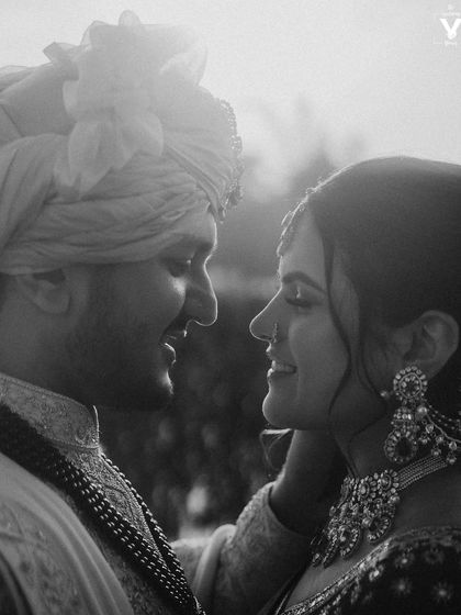 A beautiful black and white close-up, focusing on the couple's expressions. The soft light and their gentle interaction create a portrait that is both intimate and timeless.