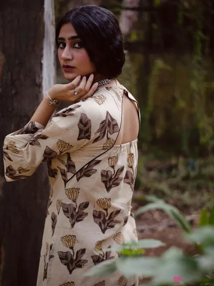 A product's unique features deserve their own spotlight. This shot is specifically framed to showcase the elegant cut-out detail on the back of the kurta. It’s this kind of detail-oriented imagery that helps a brand communicate the thoughtful design elements of their apparel.