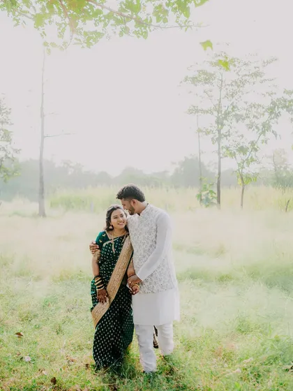 A romantic walk through a misty field. The soft light and natural surroundings create a dreamy and peaceful atmosphere for this traditional couple shoot.