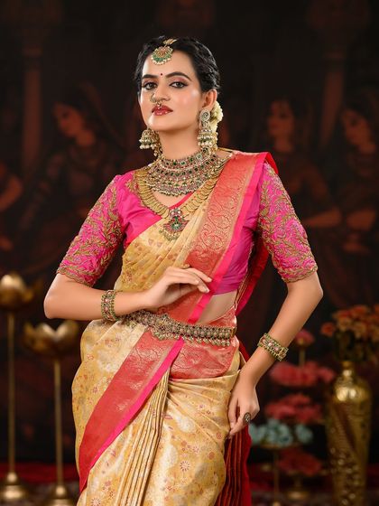 This full-length shot showcases the beautiful drape of the Kanjeevaram saree and how the makeup and styling create a complete, harmonious look.