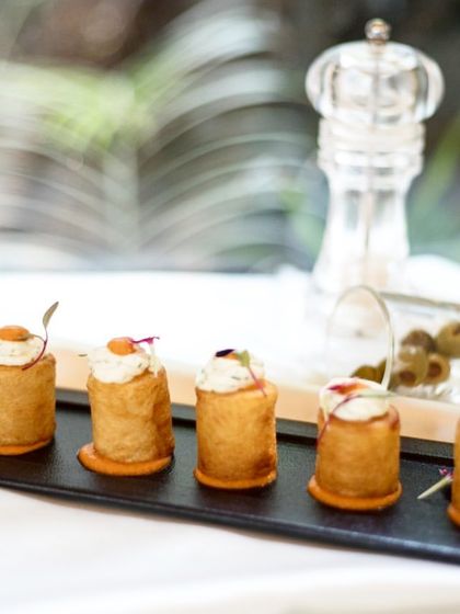 Our version of Patatas Bravas, a classic Spanish tapa. These crispy potato cylinders are topped with a creamy sauce and are incredibly addictive.