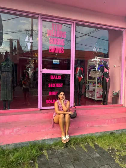 Just sitting outside the cutest pink bikini shop in Bali. My crochet co-ord set fits right in. I love finding outfits that match the vibe of the location.