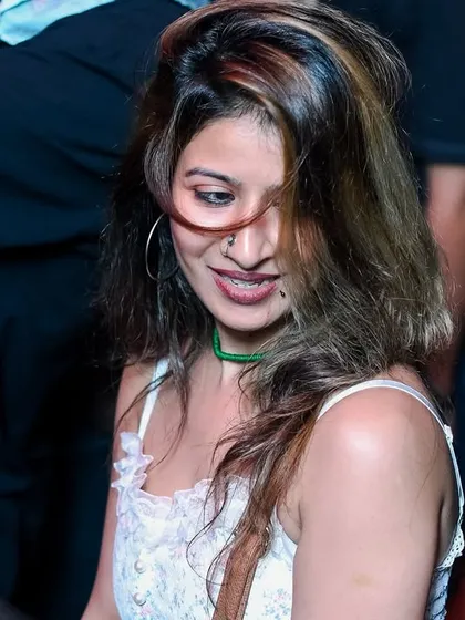 A candid shot of someone in the crowd enjoying the music.