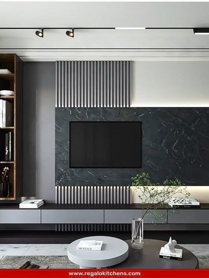 A bold and graphic TV unit with vertical fluted panels against a dark marble backdrop. The floating console adds to the modern, streamlined look.