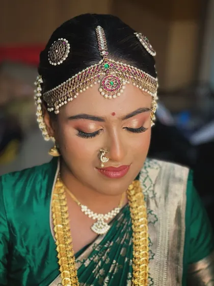 A close-up of this bride's makeup, with soft, shimmery eyeshadow and a flawless base.