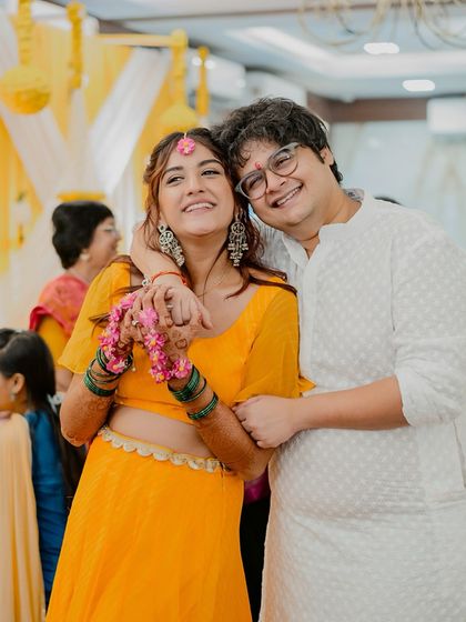 A sweet, candid portrait of the couple during a quiet moment at their Haldi ceremony.