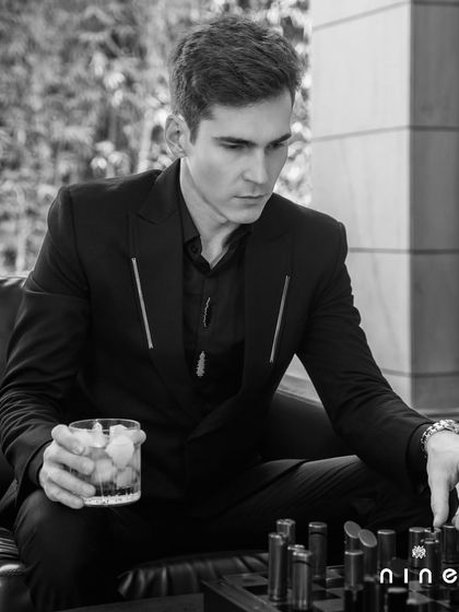 A black-on-black look from our 'Metal Bling' collection, featuring a suit with sleek metal zip details for a modern, minimalist aesthetic.