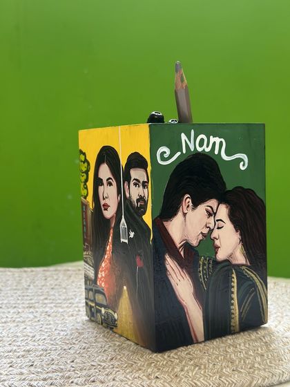 A custom pen stand we created for a movie lover. Each side features a hand-painted scene from a famous film. Can you guess the movies?