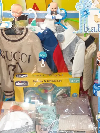 This hamper includes a designer-inspired sweater and a Chicco teether and rattle set.