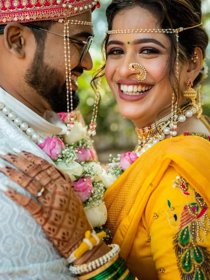 The happiest smiles are the most beautiful. This candid shot captures the pure joy of a Maharashtrian bride, her radiant makeup enhancing her infectious happiness.