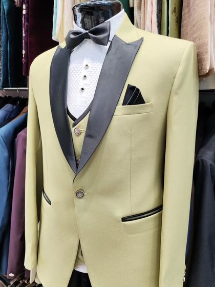 A collection of our designer suits, showcasing a variety of colors, fabrics, and custom details like embroidery, unique lapels, and accessories. Each piece is crafted to make a lasting impression.